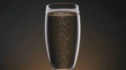 Bubbles rising in a glass of sparkling wine